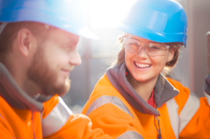 Image of two young people in hard hats
